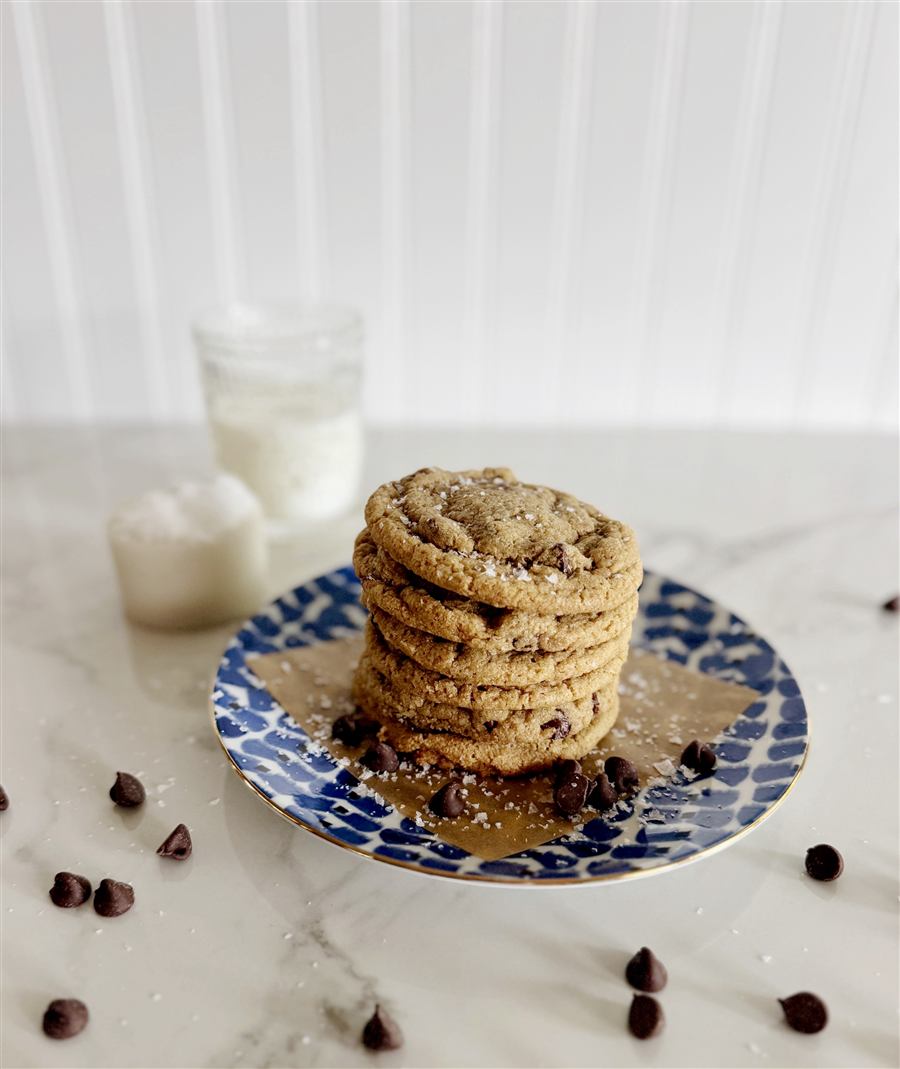 Stack of sourdough chocolate chip cookies with milk